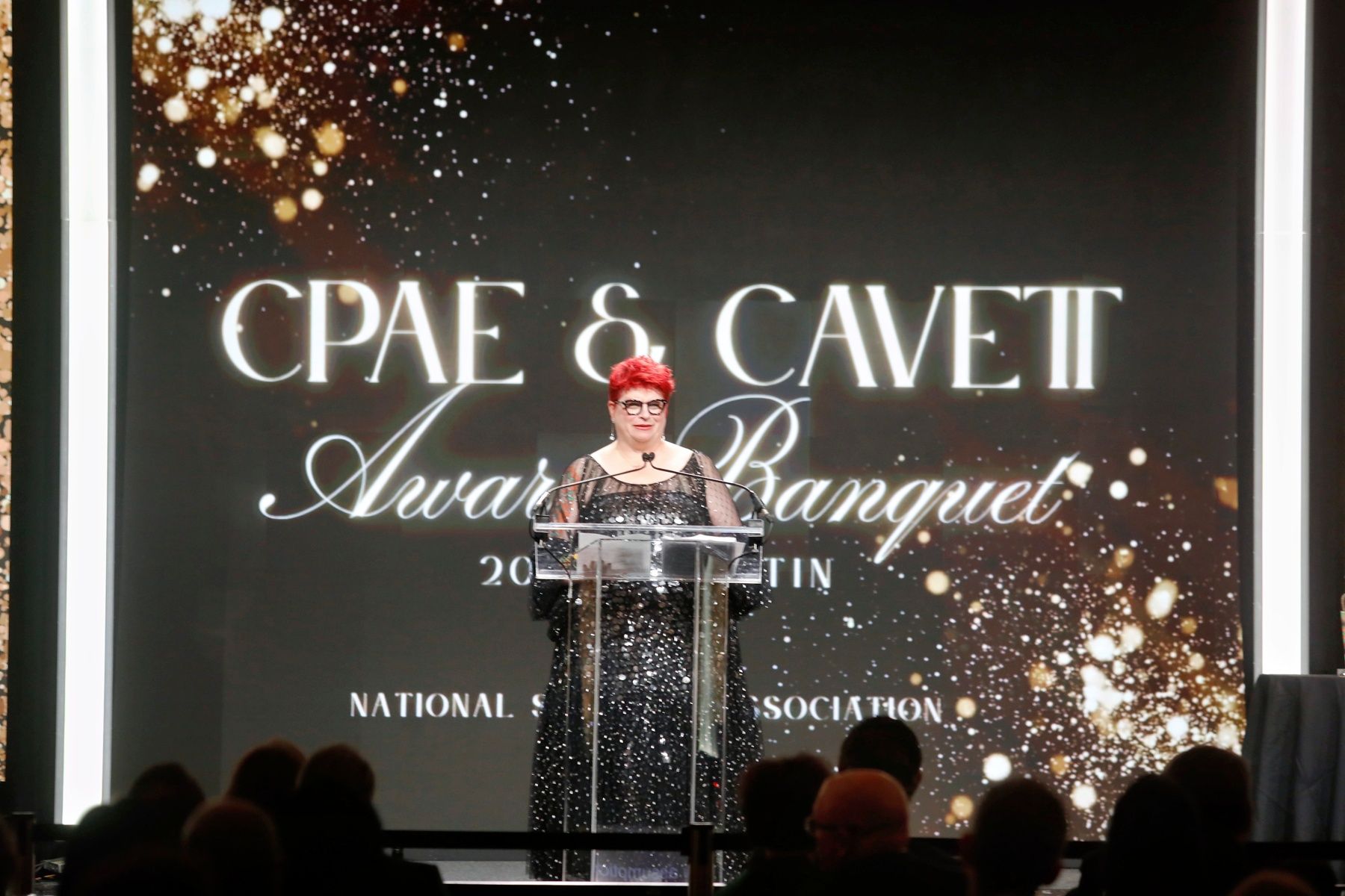 Jess Pettitt on stage accepting the CPAE Speaker Hall of Fame award